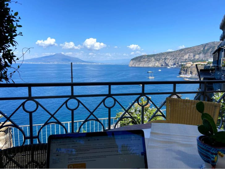 Remote working and flexibility view of the sea and laptop
